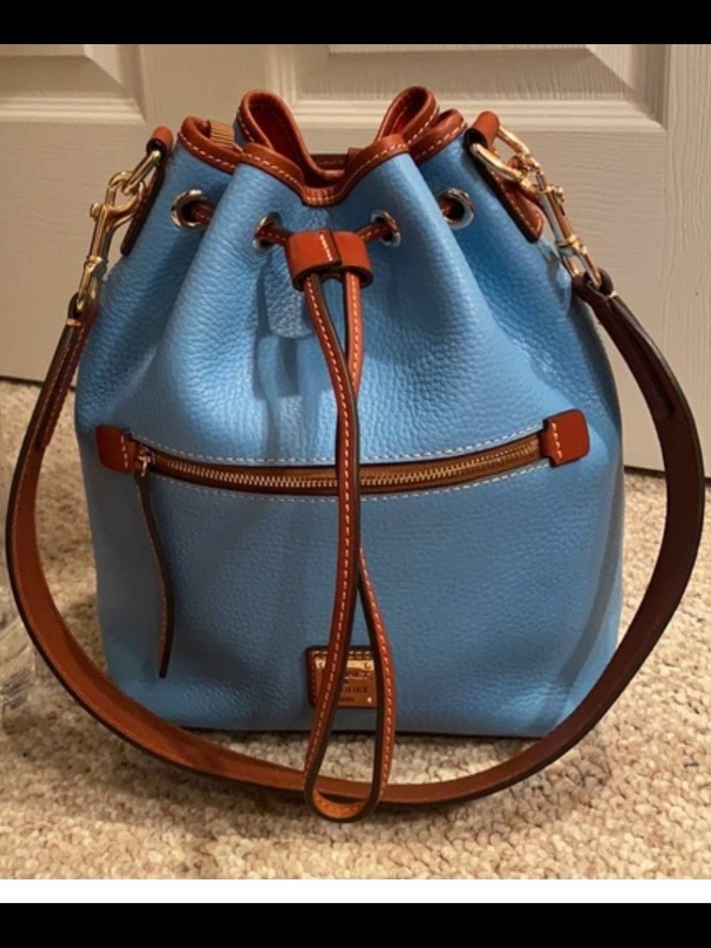 Dooney and Bourke Blue Pebbled Leather Drawstring Bucket Bag with Brown Trim